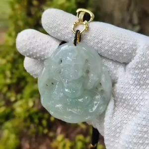 Carved as Sudhanakumāra Natural Type A Jadeite Pendant with NGI Gemstone report weight 235.93 grams 52.90 * 48.13 * 12.50 mm Translucent fine grain crystal aggregate near colorless to faint green with good translucency (pendant133)