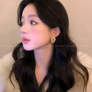 Golden Sparkling Tassel Earrings: A Luxurious & Versatile Fashion Statement