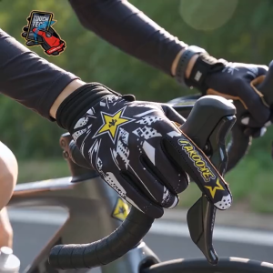 Space-themed gloves with "To the Moon" design. Black and white color options. Adjustable wrist straps. Touch screen compatible. Suitable for cycling or motorcycling. Displayed on a flat surface.