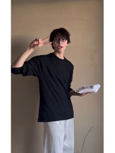 เสื้อยืดคอกลมแขนยาวผ้าฝ้ายแท้สีดำสำหรับผู้ชาย ทรงหลวม ระบายอากาศได้ดี ทรงปกติ ฤดูใบไม้ผลิ 2025 แฟชั่น