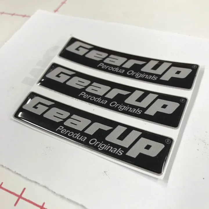 GEAR%20UP%20Logo%20Emblem%20Original%20Design%20Perodua%20Bezza%20Acia%20Myvi%20Ativa%20Alza%20Aruz%20Kancil%20Kelisa%20Kenali%20Kembara%20%20%20Size:%207cm%20x%201.6cm%20%20Ukuran:%2070%20x%2016mm%20%20Sticker%203M%20Original%20Design%20Perodua%20Emblem%20-%20Image%202