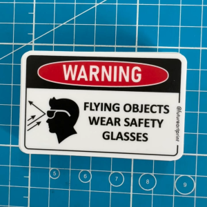 Warning Flying Objects. Splash Hazard. Wear Safety Glasses Eye Protection. Sticker Sign Danger Caution Signage Label.