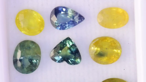 ชุดพลอยไพลินธรรมชาติ สีเขียวอมฟ้า(ทีล) เขียว และเหลือง สำหรับงานสั่งทำจิวเวลรี่ - เจียระไนทรงกลม ทรงรี และทรงหยดน้ำ รวม 9 เม็ด 5.28 กะรัต