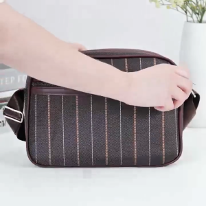 WENKEN BAGS#8742 Men`s sling shoulder bag eatures multi-zipper layout with three compartments and an adjustable strap.