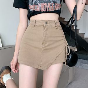 กระโปรงสั้นผ้ายีนส์เอวสูงทรงเอเข้ารูปสไตล์เกาหลีสำหรับสาวๆ ฤดูร้อนปี 2023 กระโปรงสั้นผ้ายีนส์ทรงเอเข้ารูปเอวสูงสำหรับสาวๆ