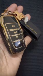 เคสรีโมทรถ  Toyota Fortuner Leader 4 ปูดำเงาเส้นสีทอง ฝาปิดด้านหลังใสดูเรียบหรู (Black Gold-Line TPU Key Case) สำหรับ Toyota Key Sets Camry 2015-18 และ Toyota Fortuner Leader GR MC Legender 4 ปู
