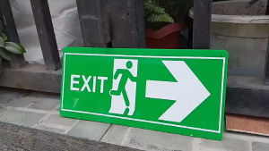 Green exit sign with white arrow and running figure. 3mm acrylic material. Non-luminous. Wall decor for home.