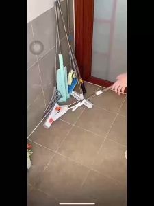 Self-adhesive no-drill mop and broom holder with stainless steel hooks suitable for kitchens toilets and bathrooms.