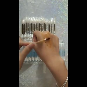 Single-use iodine cotton swabs individually packaged with a snap-to-use disinfectant for wound care