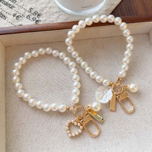 【♡Lovely girls house♡】พวงกุญแจรูปโบว์เปลือกหอยมุกแวววาวจี้ห้อยกระเป๋าน่ารัก