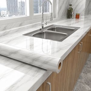 A Roll Of Glossy Refurbished Style Marble Patterned Grease Proof Film Suitable For Various Surfaces Such As Walls And Tabletops.