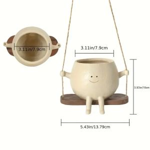 Swing flower pots with cute smiling face designs unique decorative items. An excellent choice for desk ornaments at the workplace as well as for hanging in the garden or on the balcony.