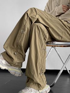 กางเกงทำงานผู้ชาย ทรงหลวม กระดุมข้าง ทรงตรง ทรงหลวม กางเกงขายาวลำลองแห้งเร็ว สีน้ำตาล กางเกงตกปลากลางแจ้ง ฤดูร้อน ไซส์ใหญ่