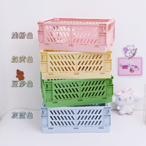 มาการองกล่องเก็บของพลาสติกพับได้สำหรับนักเรียนวางบนโต๊ะจัดระเบียบสมุดที่บันทึกด้วยมือเทปเครื่องเขียนผลิตภัณฑ์ดูแลผิวตะกร้าเก็บของขนาดเล็ก