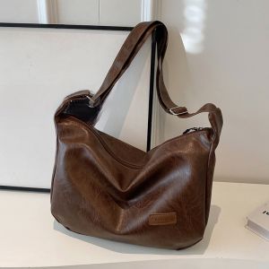 กระเป๋าสะพายข้างหนังนิ่มแบบลำลองสำหรับผู้หญิง กระเป๋าเดินทางทรงจี้สีขาวสไตล์ใหม่ปี 2025 กระเป๋าสะพายข้างทรงกลมขนาดใหญ่