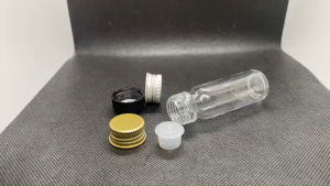 ขวด 15 มล. (50ใบ) แก้วกลม ใส +จุกรู+ ฝาโลหะ#22mm