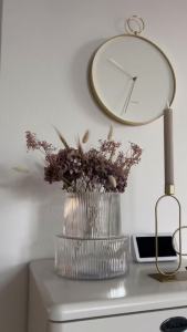 Karlsson wall clock L43cm Hook metal white gold plated case. Design by Anne Rieck.