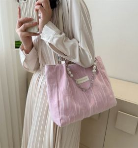 2023 ฤดูใบไม้ผลิฤดูใบไม้ร่วงเยาวชนขนาดใหญ่ความจุกระเป๋าสีชมพูแม่เหล็กหัวเข็มขัดไนลอนกระเป๋าสะพายไหล่เดียวสําหรับโรงเรียนและการเดินทาง
