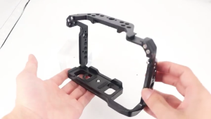 Black camera rig cage for A72/A7R2 models with multiple mounting holes and a central screw mount.