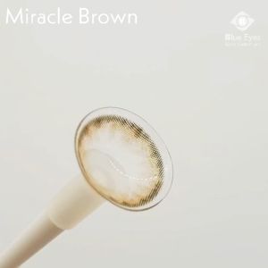 Kính áp tròng Miracle Brown Blue Eyes dòng lens cận sử dụng sáu tháng giãn tròng vừa màu nâu rêu viền xám MIR-BR