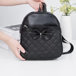 ABC BAGS#1202 Trendy 10inches Women`s backpack featuring  a prominent matching bow embellishment on the front panel