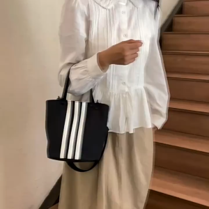 MOUSSON กระเป๋าทรงถังแบบพกพาสไตล์สปอร์ตลำลองกระเป๋าสะพายไหล่แบบพกพาสำหรับพร็อพแบบเรียบง่ายความจุขนาดใหญ่กระเป๋าผู้หญิงสะพายไหล่ลายทางสไตล์เกาหลี