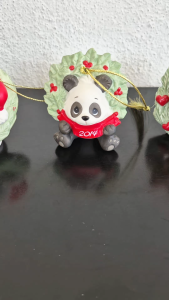 2014 Precious Moments panda surrounded by a holly wreath - Happy holly-days