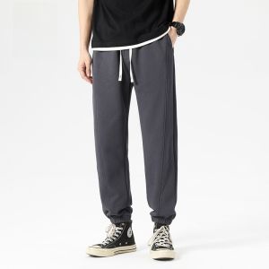 ROMON | Quần dài thể thao Harlan rộng rãi cho nam mùa xuân hè mới màu đen quần dài thể thao co giãn thoải mái thoáng khí