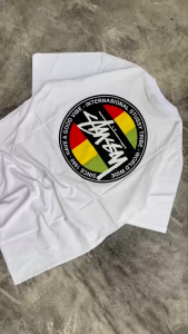 Kaos Stussy - tshirt stussy - kaos pria - tshirt pria - baju pria - kaos pria stussy REGGAE PUTIH