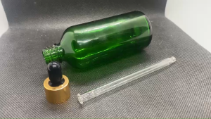 ขวด 100 มล.(50ใบ) แก้วสีเขียว+ฝาทอง+บีบดำ+หลอดแก้ว 09#18