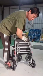 Lightweight and simple aluminum alloy folding wheelchair ultra-light travel trolley portable adult wheelchair aircraft wheelchair with pull rod