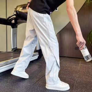กางเกงลําลองผู้ชายบางอเมริกันแฟชั่นแบรนด์ความรู้สึกหล่อของการออกแบบloosestraight ขาแห้งเร็วกีฬากางเกงหลวม