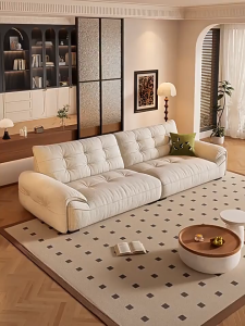 Modern minimalist fabric sofa for living rooms of all sizes in a block shape.