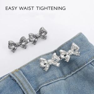 ปุ่มปรับรูปโบว์2ชิ้นสำหรับกางเกงและกระโปรงรัดเอวปรับได้เข็มขัดเอวสำหรับกางเกงยีนส์ไม่จำเป็นต้องเย็บ