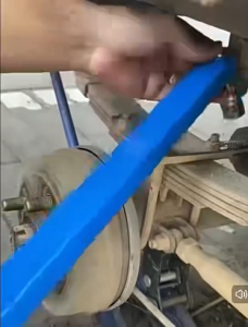 Blue multi-functional ratchet extension universal wrench automotive hand tool.