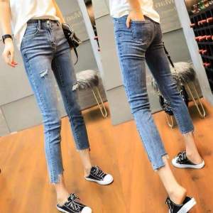 ผู้หญิง สูง เอว กางเกงยีนส์สกินนี่ ฤดูร้อน รูปแบบใหม่ ยืดได้ เจาะรูข้อเท้ายาว พรางหุ่น ไม่สม่ําเสมอ ผ้าฝ้าย ยืด เดนิม