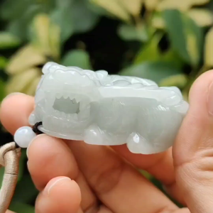 New arrival in SG - Flying Pixiu with movable ball in mouth crafted on Natural Jadeite Jade as Pendant with QIC labs approved certificate weighs 49.07 grams measurement 45.8 * 23.2 * 19.7 mm (pendant322)