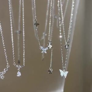 สร้อยคอรูปหัวใจผีเสื้อดาวที่สง่างามสำหรับผู้หญิงทิวลิปมูกคริสตัลเพทายสีทองโซ่เงินเครื่องประดับอัญมณีสร้อยคอแบบโชคเกอร์