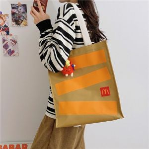 กระเป๋านักเรียนของ JENL McDonald กระเป๋าหนังสือพิมพ์ลายกระเป๋าผ้าใบสำหรับกระเป๋าสะพายไหล่สำหรับเด็กผู้หญิงลำลองกระเป๋านักเรียน