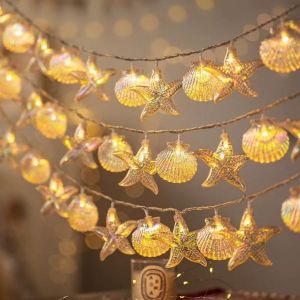 สายไฟเปลือกหอยปลาดาว LED พร้อมเปลือกสีสันสดใส ฝันและสง่างาม เต็มไปด้วยองค์ประกอบมหาสมุทรที่ประดับบรรยากาศภายในบ้าน