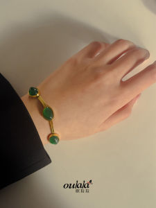 Oulala High-End ไทเทเนียมสร้อยข้อมือผู้หญิงแฟชั่นมรกตสีเขียวอัญมณีออกแบบ Gold-Plated Luxury อุปกรณ์เสริม