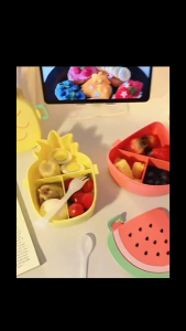 Cute and portable lunch box with fruit-shaped three-section compartmentalized lunch container that does not cause food to mix and spoil.