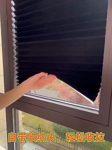 Self-adhesive pleated curtain for office privacy. Simple perforationless shading curtain for household use