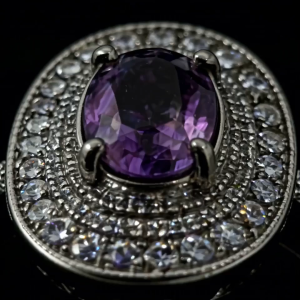 A gentle ethereal crystal ring adorned with a dazzling purple accent crystal