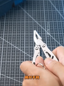 All-steel pliers multi-functional tool folding knife portable outdoor carry-on combination keychain bottle opener screwdriver