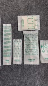 Combo 200 bộ bàn chải bột bắp + kem 2g bao bì môi trường trắng in màu xanh