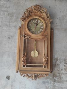 Jam Dinding Kayu Jati Ukiran Jepara 35 X 70 X 6 Cm