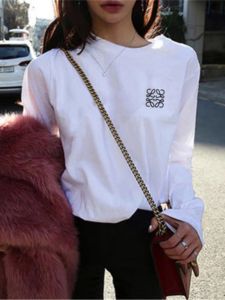 สไตล์เกาหลี โอเวอร์ไซส์ เสื้อยืดแขนสั้นปักลายแขนยาวผู้ชายผู้หญิงคลาสสิก สีขาว บริสุทธิ์ ผ้าฝ้าย เสื้อคู่ดาวอินเทอร์เน็ตสีแดง