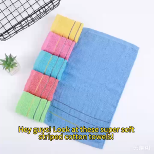 Blue towel with yellow stripes and five folded towels in yellow pink blue red and green.
