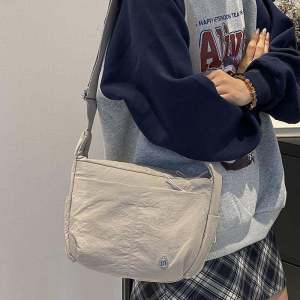 Waterproof Nylon Crossbody Bag for Women: A Must-Have Large Capacity Casual Travel Shoulder Bag with Simple Design Sports Cloth Bag Commuter Style